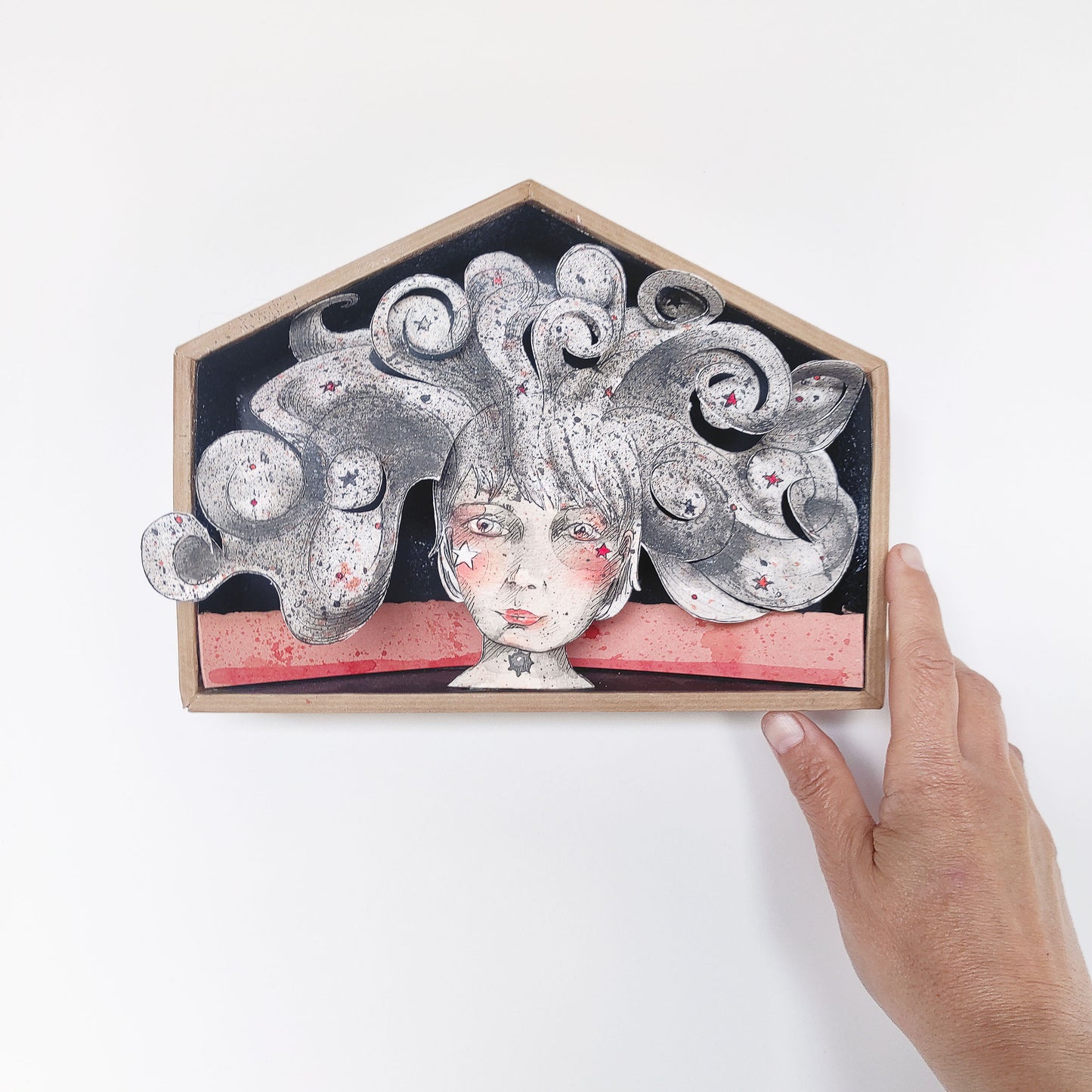 Arte pop-up En la cabeza colgado en pared como decoración